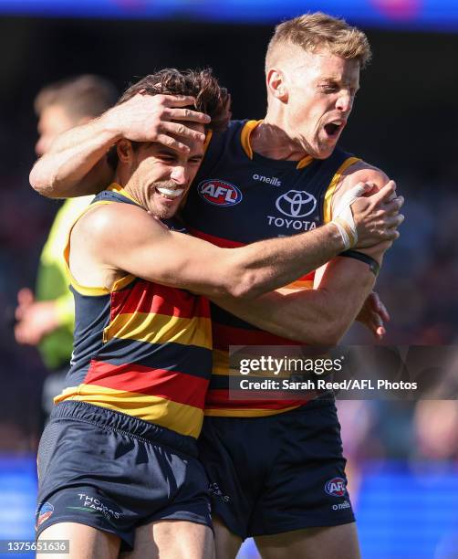 Lachlan Murphy of the Crows celebrates a goal with Rory Sloane during the 2023 AFL Round 16 match between the Adelaide Crows and the North Melbourne...