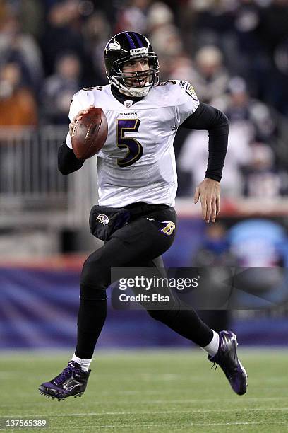 Joe Flacco of the Baltimore Ravens runs with the ball against the New England Patriots during their AFC Championship Game at Gillette Stadium on...