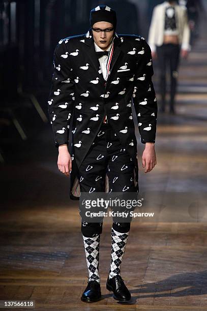 Model walks the runway during the Thom Browne Menswear Autumn/Winter 2013 show as part of Paris Fashion Week on January 22, 2012 in Paris, France.