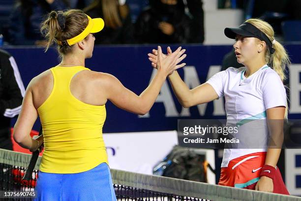 Elina Svitolina of Ukraine and Anastasia Potapova of Russia shake hands after a match between Anastasia Potapova of Russia and Elina Svitolina of...