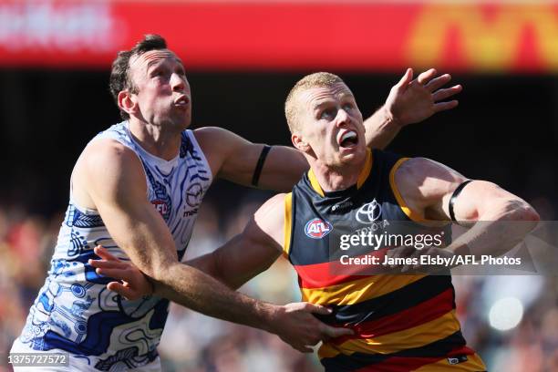 Reilly O'Brien of the Crows competes with Todd Goldstein of the Kangaroos during the 2023 AFL Round 16 match between the Adelaide Crows and the North...