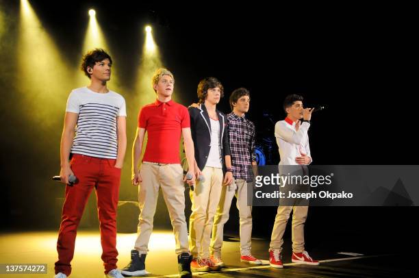 Louis Tomlinson, Niall Horan, Harry Styles, Liam Payne and Zayn Malik of One Direction perform at HMV Hammersmith Apollo on January 22, 2012 in...