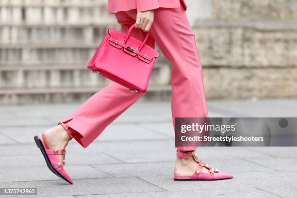 Influencer Alexandra Lapp wearing a pink Kelly bag by Hermes and pink flat sandals with gold studs by Valentino, seen during Paris Fashion Week...