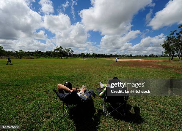 Daniel Mill and Dempsey McCoy from the team 'Wolf Pack' sit in field to score a match during the 2012 Goldfield Ashes cricket competition on January...