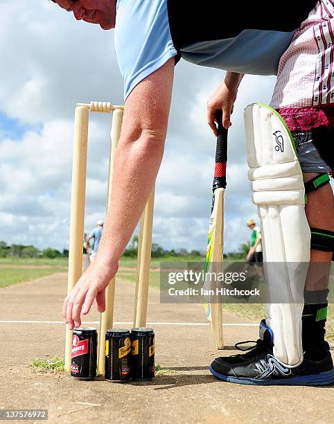 Player from the team 'Wannabies' picks up a drink while batting during the 2012 Goldfield Ashes cricket competition on January 21, 2012 in Charters...