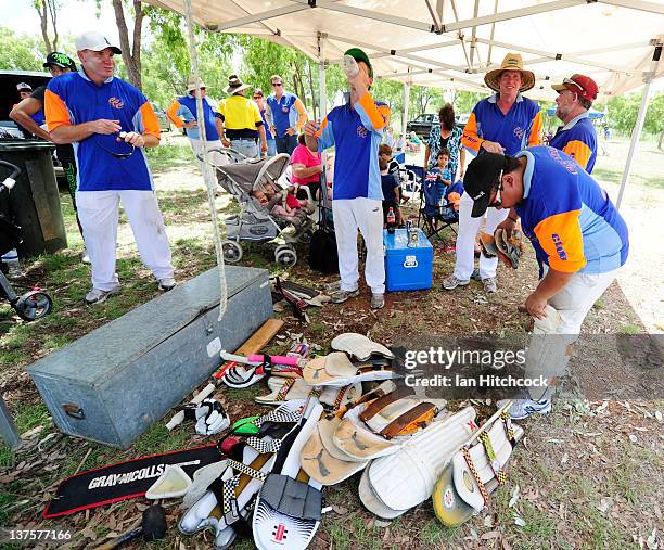 The team 'Croyden Carneys' get ready to go out and field during the 2012 Goldfield Ashes cricket competition on January 22, 2012 in Charters Towers,...