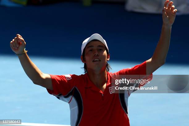 Kei Nishikori of Japan celebrates winning his fourth round match against Jo-Wilfried Tsonga of France during day eight of the 2012 Australian Open at...