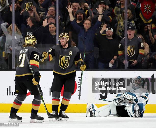 William Karlsson and Reilly Smith of the Vegas Golden Knights celebrate after Karlsson assisted Smith on a third-period goal against Zach Sawchenko...