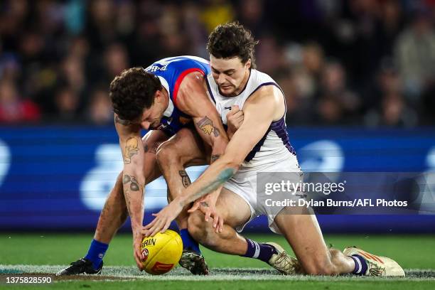 Tom Liberatore of the Bulldogs and Jordan Clark of the Dockers compete for the ball during the 2023 AFL Round 16 match between the Western Bulldogs...