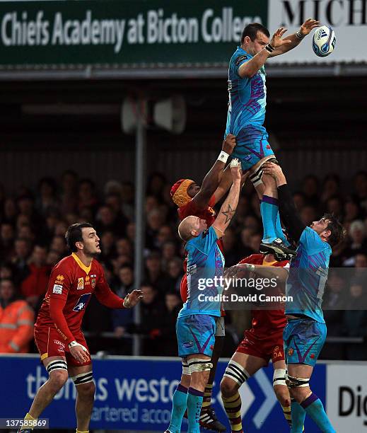 Tom Hayes of Exeter Chiefs is lifted in a line out during the Amlin Challenge Cup match between Exeter Chiefs and Perpignan at Sandy Park on January...