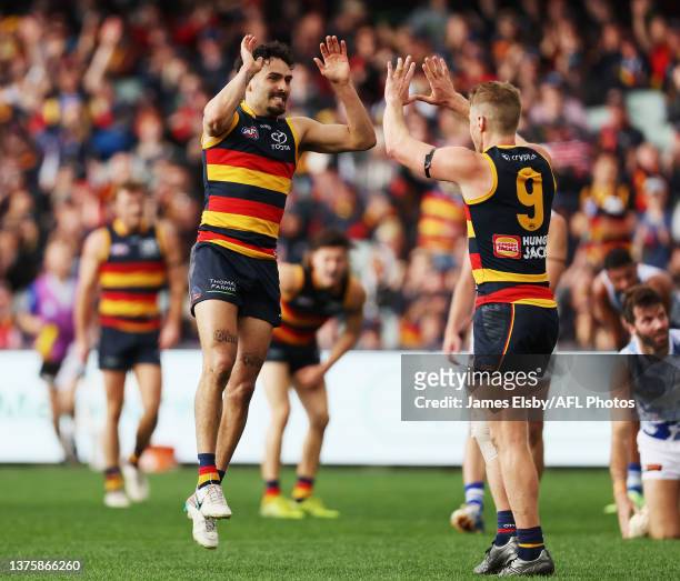 Izak Rankine and Rory Sloane of the Crows celebrate a goal during the 2023 AFL Round 16 match between the Adelaide Crows and the North Melbourne...