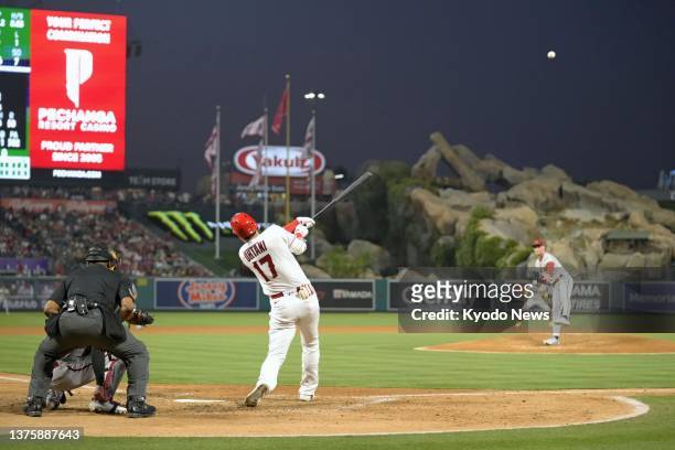 Shohei Ohtani of the Los Angeles Angels hits his 30th homer of the season during the sixth inning of a baseball game against the Arizona Diamondbacks...