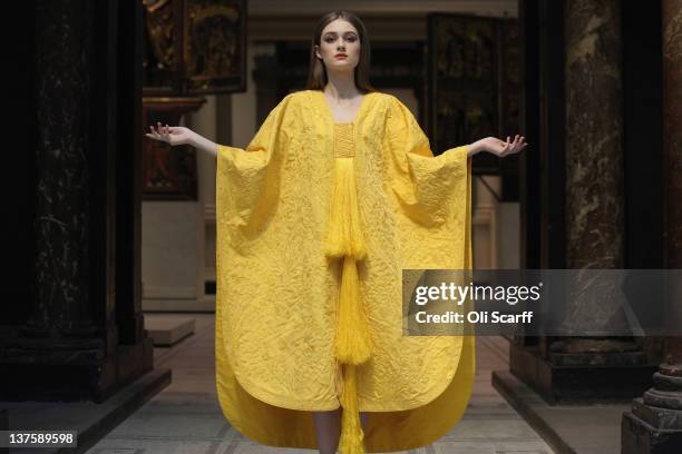 Model Bianca Gavrilas wears a a hand-embroidered cape made from the silk of the Golden Orb Spider in the V&A Museum's Medieval and Renaissance...