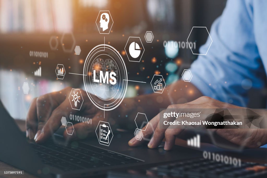 Businessman using a computer to LMS - Learning Management System web icon for lesson and online education, course, application, study, e learning, knowledge everywhere and every time."n