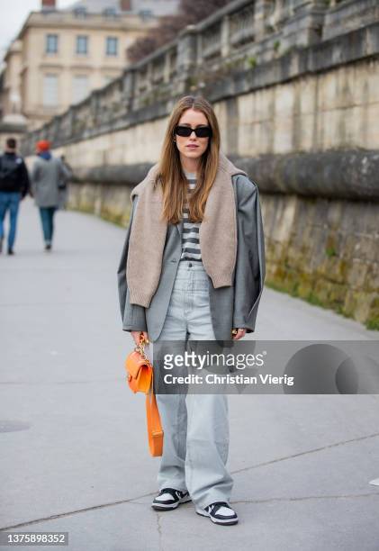 Annabel Rosendahl wearing orange Chanel bag, grey blazer, striped shirt seen outside Dior during Paris Fashion Week - Womenswear F/W 2022-2023 on...