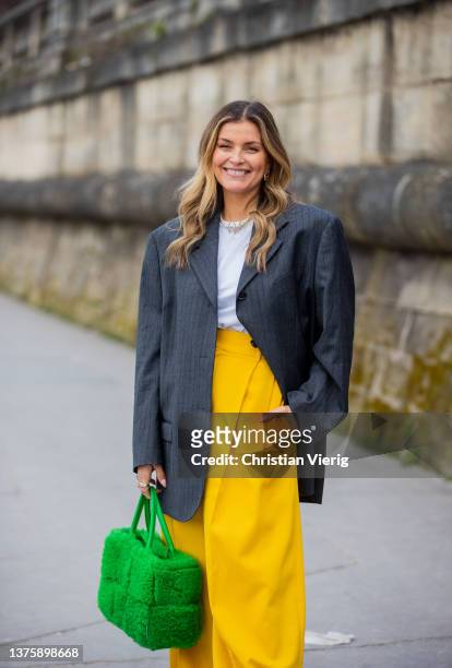 Janka Polliani wearing grey blazer, green bag, yellow wide leg pants, white shirt seen outside Dior during Paris Fashion Week - Womenswear F/W...