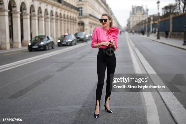 Influencer Alexandra Lapp wearing a black oversize blazer by Pernille x Mango, a pink flower accent blouse by Magda Butrym, black leggings by Saint...