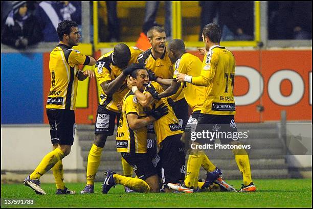 Mijat Maric of Sporting Lokeren OVL celebrates scoring a goal with his teammates during the Cofidis Cup quarter-final match between KAA Gent and...