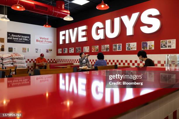 Diners inside the first outlet of US burger restaurant chain Five Guys in the Gangnam District of Seoul, South Korea, on Saturday, July 1, 2023. The...