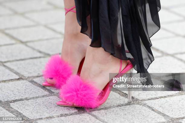 Influencer Emilie Higle wearing hot pink feather wrap high heel sandals with transparent heel by Boohoo, seen during Paris Fashion Week Fall/Winter...