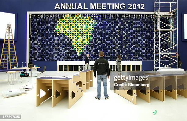 Workers prepare the main hall inside the Congress Centre in Davos, Switzerland, on Monday, Jan. 23, 2012. German Chancellor Angela Merkel will open...