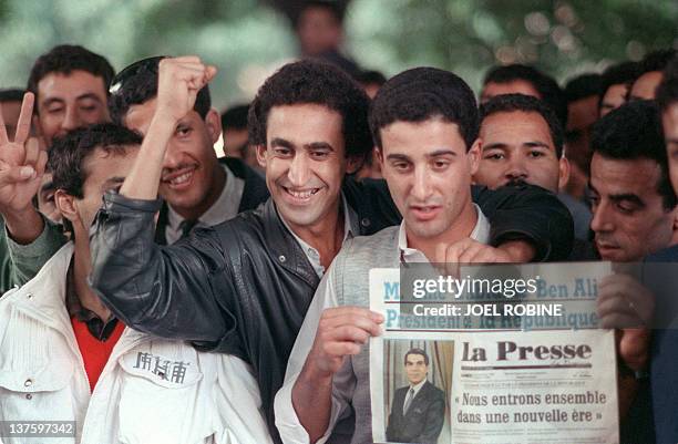 Tunisians celebrate the deposition of president-for-life Habib Bourguiba, 07 November 1987 in Tunis, and wait for the new president Zine el-Abidine...