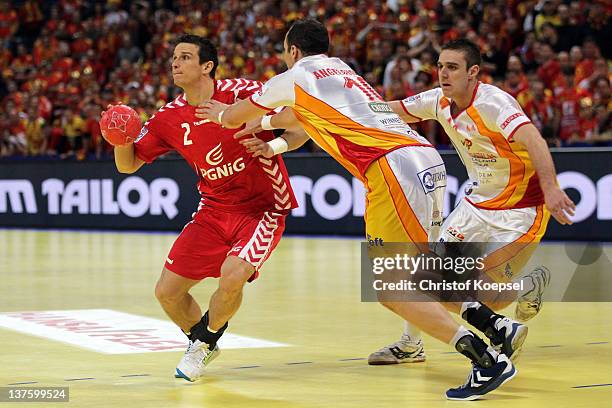 Bransilav Angelovski of Macedonia defends against Bartolomiej Jaszka of Poland during the Men's European Handball Championship second round group one...