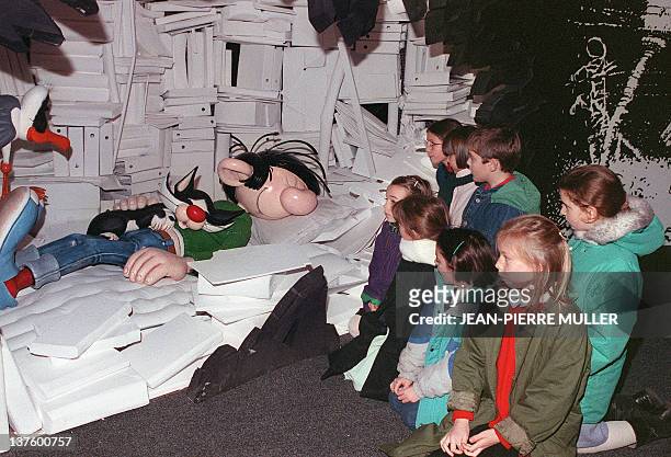 Children look at comics strip character Gaston Lagaffe, 28 January 1989, at the Angoulême comics show. Gaston Lagaffe, who made his first apparition...