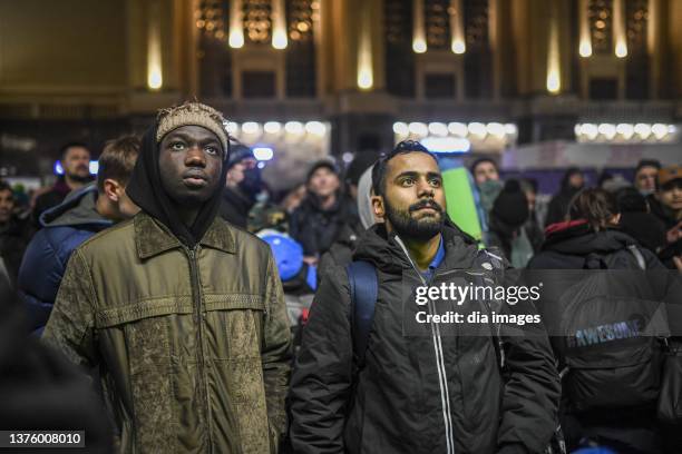 People wait at a train station to board trains in an attempt to flee the fighting in Kyiv on March 2, 2022 in Kyiv, Turkey.