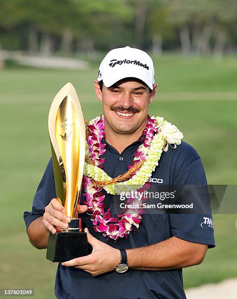 Johnson Wagner holds the trophy after winning the Sony Open in Hawaii at Waialae Country Club on January 15, 2012 in Honolulu, Hawaii.