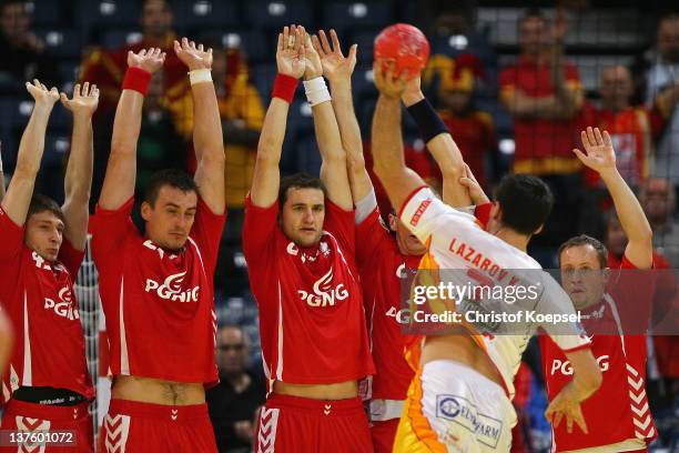 Kiril Lazarov of Macedonia throws against the polish wall during the Men's European Handball Championship second round group one match between Poland...