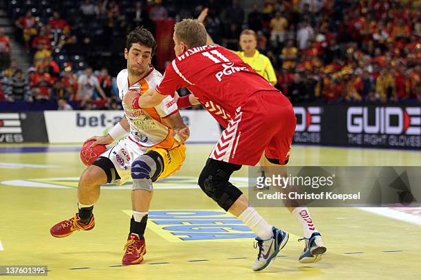 Adam Wisniewski of Poland defends against Filip Mirkulovski of Macedonia during the Men's European Handball Championship second round group one match...