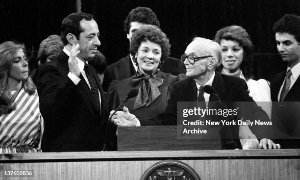 Mario Cuomo Inauguration Mario Cuomo is sworn in as 52d governor of New York by Judge Charles Desmond as Cuomo's wife Matilda, looks on in Albany.