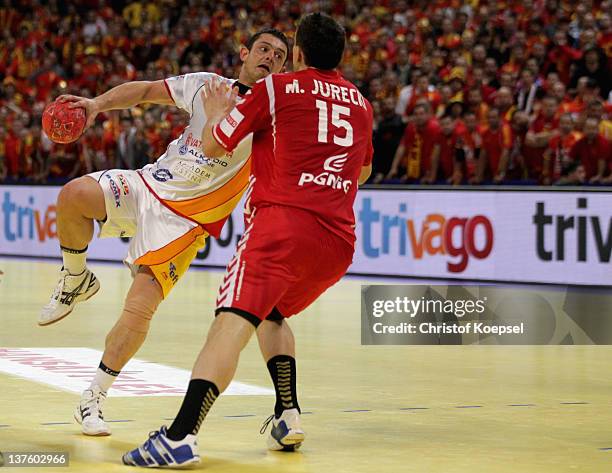 Michal Jurecki of Poland defends against Naumche Mojsovski of Macedonia during the Men's European Handball Championship second round group one match...