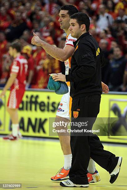 Kiril Lazarov of Macedonia is treated after an injury during the Men's European Handball Championship second round group one match between Poland and...