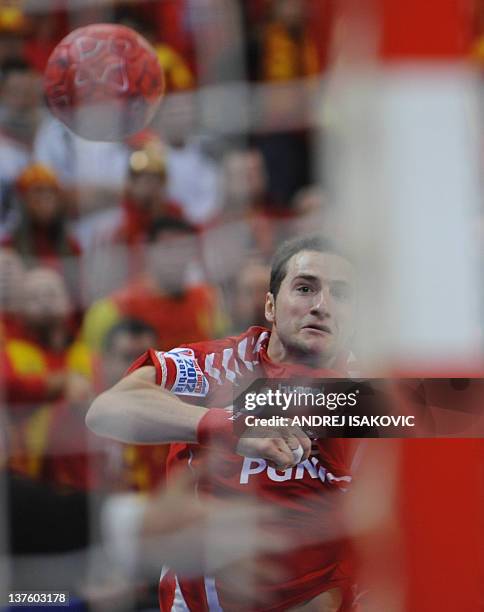 Poland's Mariusz Jurkiewicz scores during the men's EHF Euro 2012 Handball Championship match between Poland and FYR Macedonia at the Belgrade Arena...