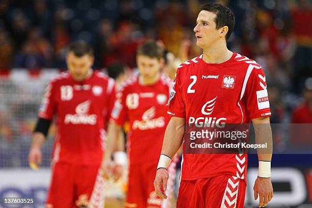The team of Poland and Bartolomiej Jaszka looks dejected after losing 25-27 the Men's European Handball Championship second round group one match...