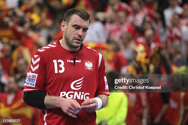 Bartosz Jurecki of Poland looks dejected after losing 25-27 the Men's European Handball Championship second round group one match between Poland and...