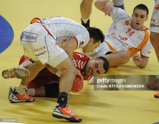 Poland's Bartosz Jurecki vies with Macedonia's defenders during the men's EHF Euro 2012 Handball Championship match Poland vs Macedonia on January...