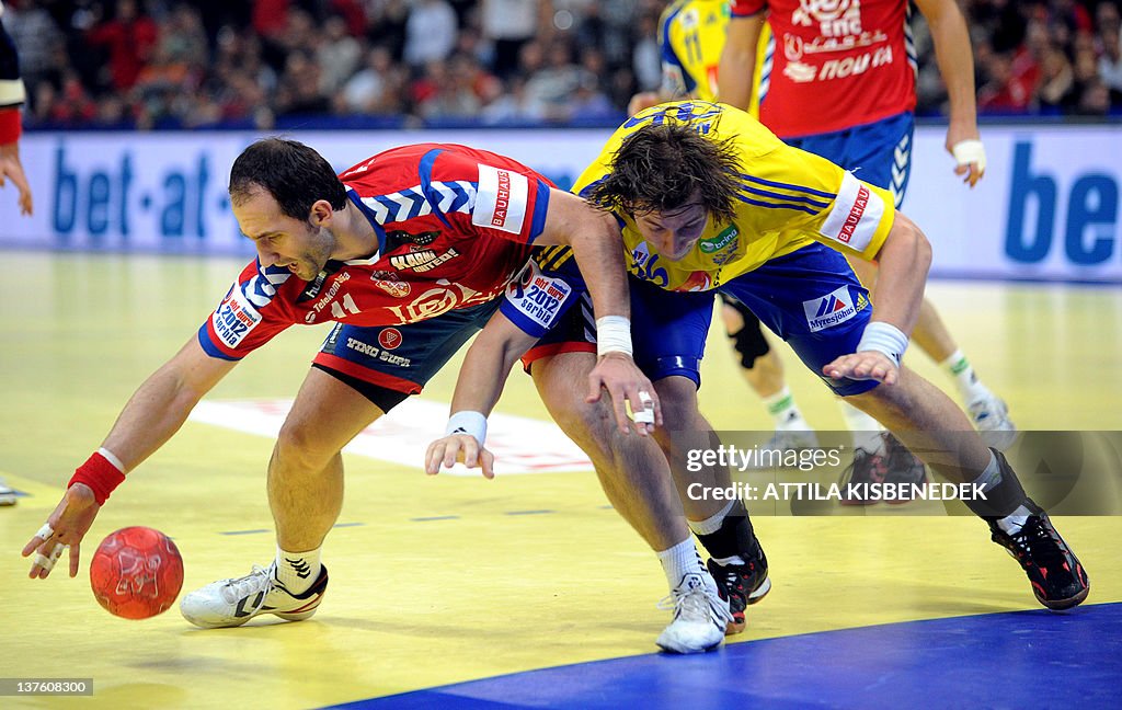 Serbian Alem Toskic (L) fights for the b