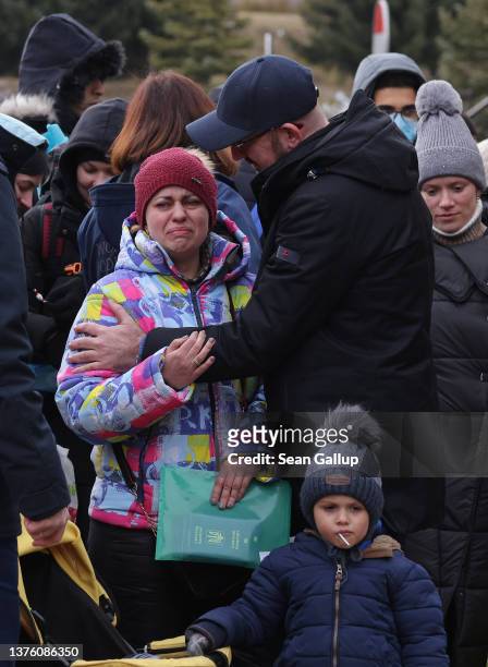 European Council President Charles Michel comforts a Ukrainian woman arriving at the Ukraine border to Poland during a visit by the Michel and Polish...
