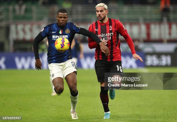 Denzel Dumfries of FC Internazionale competes for the ball with Theo Hernandez of AC Milan during the Coppa Italia Semi Final 1st Leg match between...