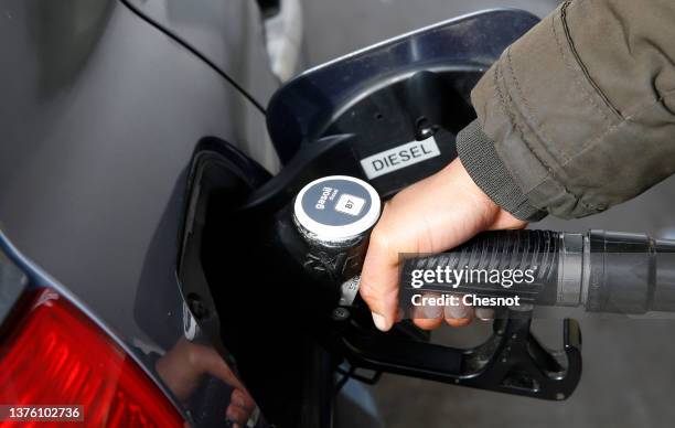 Driver refuels with gasoline at a BP petrol station on March 2, 2022 in Paris, France. Russia's war on Ukraine has led to rising prices at the fuel...