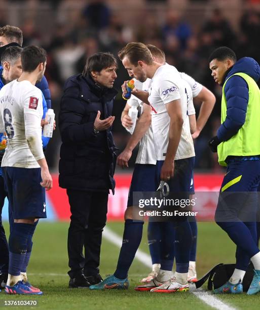 Spurs Head Coach Antonio Conte speaks to captain Harry Kane during the half time break of extra time during the Emirates FA Cup Fifth Round match...
