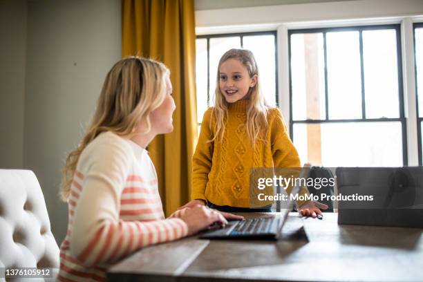 mother using laptop with tween daughter - 12 year old blonde girl stock pictures, royalty-free photos & images