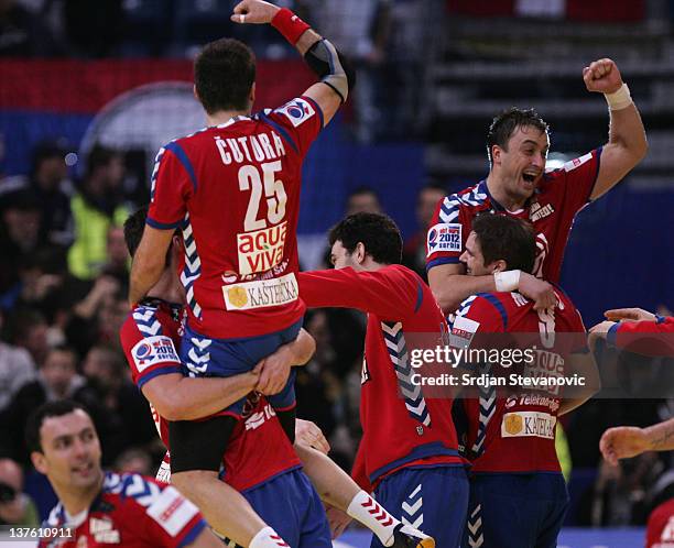 Momir Ilic and Dalibor Cutura of Serbia celebrate victory against Sweden during the Men's European Handball Championship 2012 second round group one...