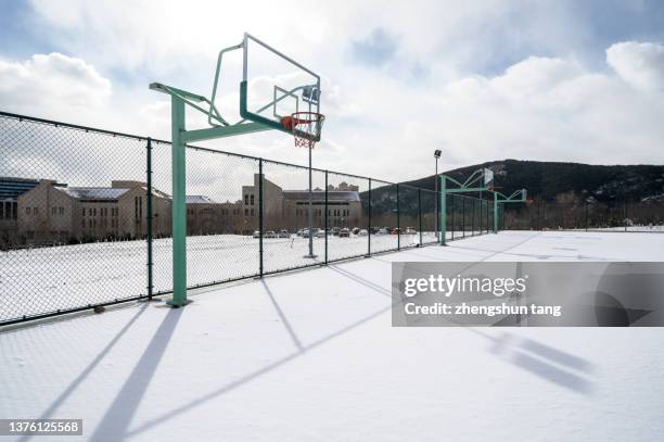 outdoor basketball court after snow - basket sport stock pictures, royalty-free photos & images