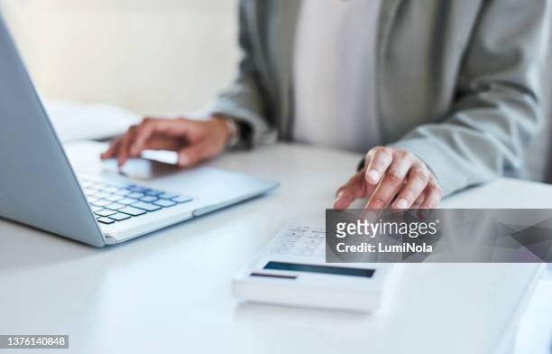 closeup shot of an unrecognisable businesswoman using a calculator and laptop in an office - wealth advisor stock pictures, royalty-free photos & images