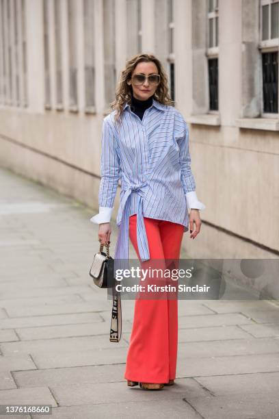 Kristine Kilty wears a Victoria Beckham shirt, roll neck jumper and trousers, sunglasses from Alfie's Antiques, Stella McCartney bag and Asos shoes...