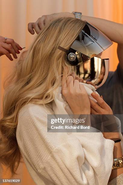 Model prepares backstage during the Jantaminiau Haute-Couture 2012 show as part of Paris Fashion Week at Le Laboratoire on January 23, 2012 in Paris,...